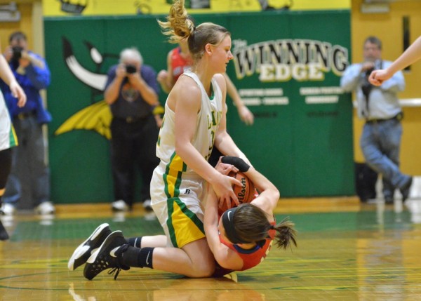 Valley's Brynda Krueger wrestles for a loose ball with Lauren Burns during Friday's semi-final. (Photos by Nick Goralczyk)