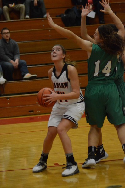 Kenzie Welk prepares to go up for two for Warsaw Friday night. The junior was outstanding with a game-high 17 points as the Tigers topped Concord 70-34 in a sectional game of the Class 4-A Goshen Sectional.