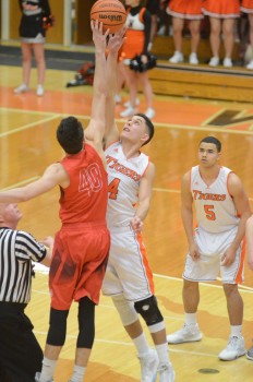 Riley Rhoades soars for the opening tip-off.