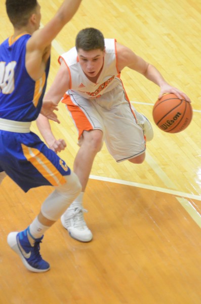 Kyle Mangas makes a move for Warsaw Saturday night. Mangas had 20 points as the Tigers lost a 36-33 final at home to Carmel.