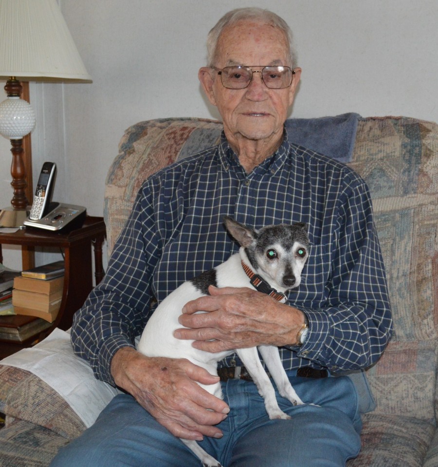 Don Shively is shown with Riley, his rat terrier dog, at his home on the west side of Claypool.