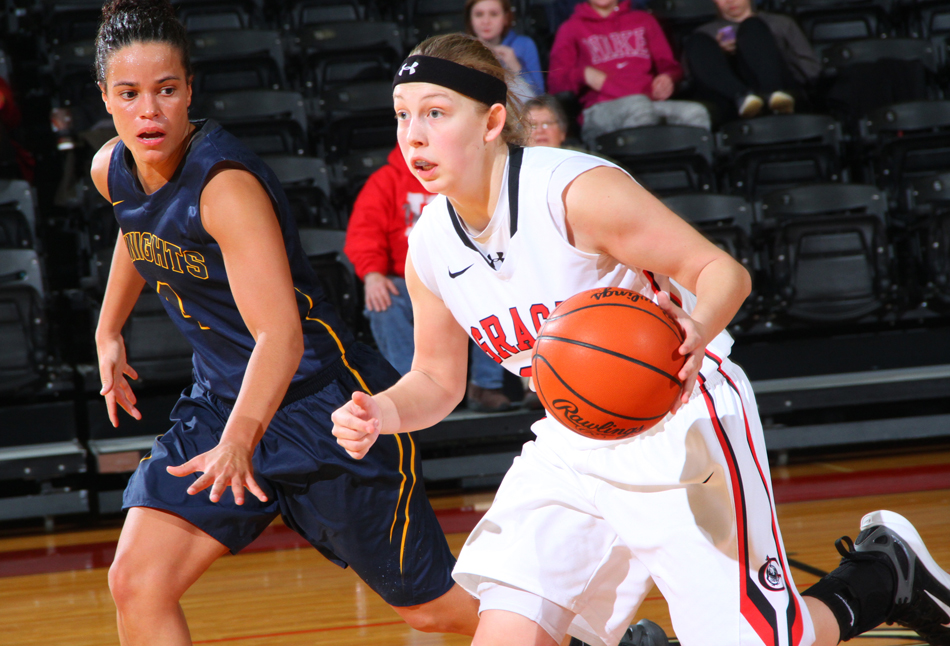 Grace's Lauren Godfrey drives against No. 3 Marian's Laken Hasser-Smith. (Photo provided by the Grace College Sports Information Department)