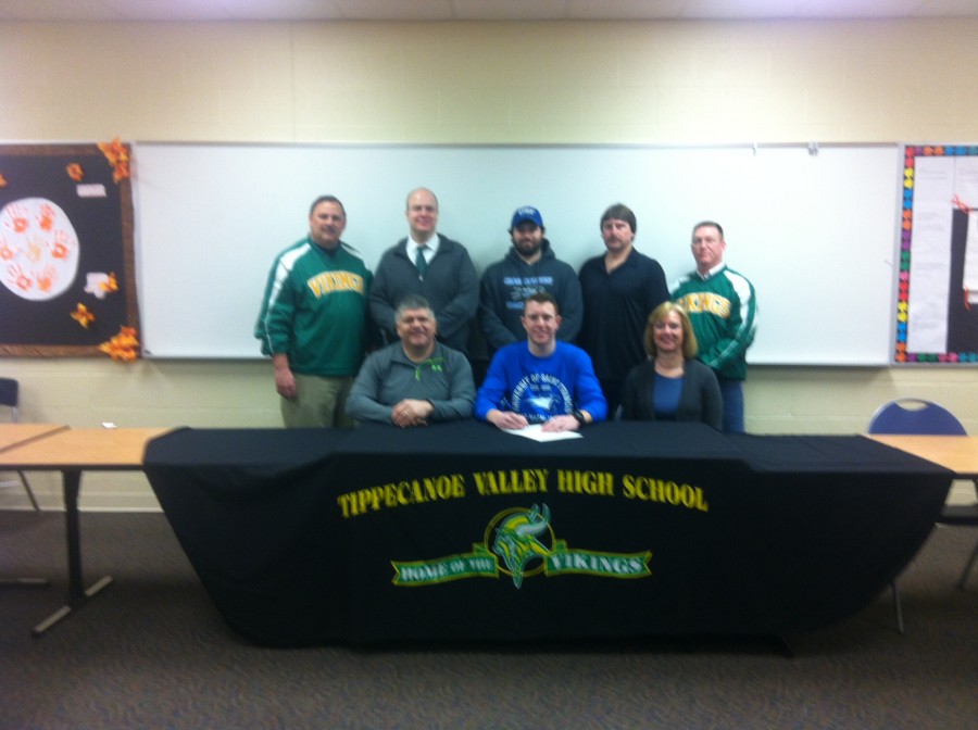 Tippecanoe Valley senior Tyler Ross signs to continue his cross country career at Saint Francis. He is shown with parents James and Brenda Ross. In back are Valley AD Duane Burkhart, Valley principal Michael Bendicsen, Saint Francis coach Adam Longworth, Valley coach Mike Inglehearn and Valley assistant AD Scott Smith (Photo provided)