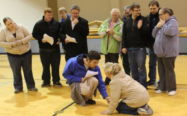 FORGIVENESS — The Lakes Area Players rehearse a scene involving Jesus and Mary Magdalene. Picture are: (kneeling) Jason Dorsett and Tami Urick; (standing, from left) Rachel Martin (Martha), Raymond Moomau (Judas Iscariot), John Asher (Andrew), Rod Urick (Peter), Lori Barsoda (Mother Mary), Buddy Martz (Simon), Robert Taylor (John), Steven Christian (Phillip) and Jennifer Christian (Mary). (Photo provided)