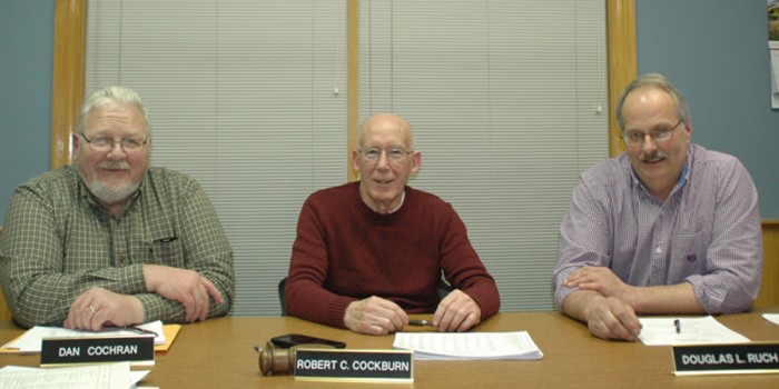 MILFORD TOWN COUNCIL — Dan Cochran, left, was elected president of Milford Town Council at its Monday, Feb. 8, meeting. Doug Ruch, right, was named vice-president. Bob Cockburn, center, served as president for two years. (Photo by David Hazledine)