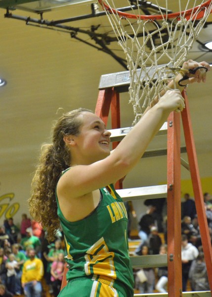 Meredith Brouyette is all smiles as she cuts down the nets for the second consecutive season. (Photos by Nick Goralczyk)