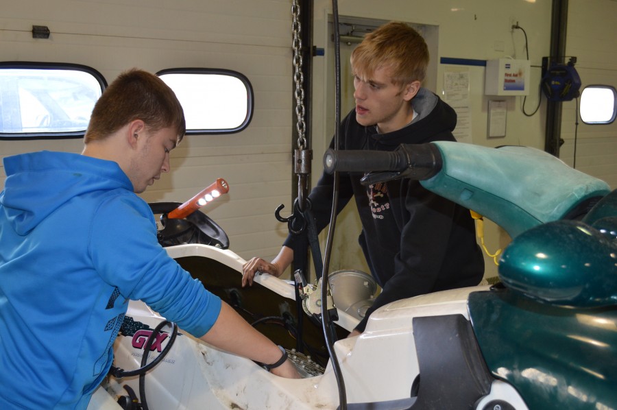 Wawasee High School students install motor.