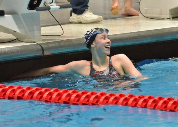 Paige Miller sends a smile towards her mom and coach after swimming a 4:55.01 in the 500 free. 