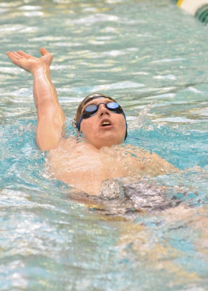 Spencer Naugler swims the 100 back during Thursday's prelims at Northridge. (Photos by Nick Goralczyk)