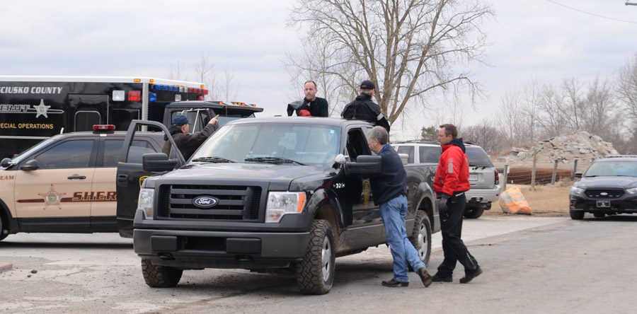 Members of the Kosciusko County Dive Team load up on back of a conservation officers truck to travel down to the gravel pit pond to begin their dive search for a potential victim. (Photos by Deb Patterson)