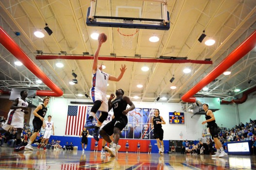 Whitko's Tanner Gaff goes to the hoop against NorthWood's Dakiyron Fox.