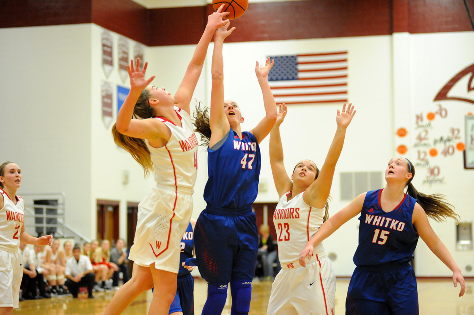 Westview's Maria McCoy blocks the shot of Whitko's Kennedy Krull during Warriors' 70-65 overtime win over the Wildcats in the championship game of the Central Noble Girls Basketball Sectional Saturday night. (Photos by Mike Deak)