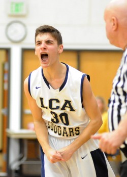 Landon Twombly reacts after hitting a basket and being fouled.