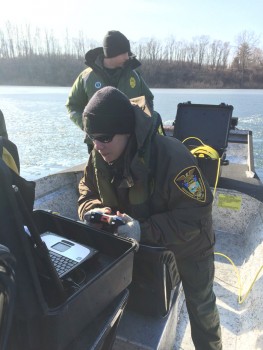 A Conservation Officer operates the submersible vehicle while viewing the images.