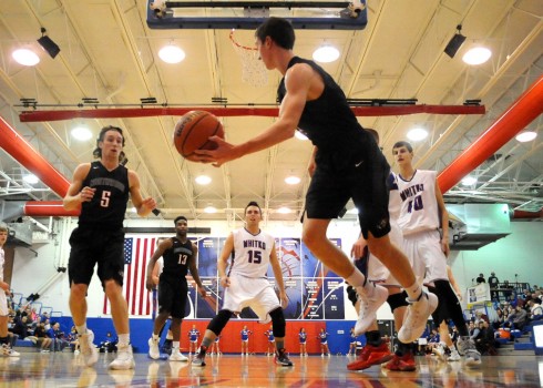 NorthWood's Luke Zurcher attempts to save a ball to teammate Vincent Miranda.