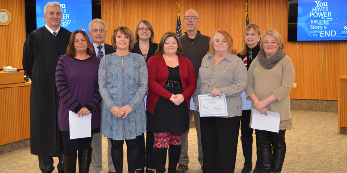 Pictured in front from left are Pat Espinoza, Mona Baum, Leslie Petko, Jane Nolin and Nikki Schultz. In back are Judge David Cates, Dennis Burch, Theresa Faulkner, Rick Swaim and Jennie Sholly. Not pictured are Terrill Brown and Rob Gruenloh. (Photos by Amanda McFarland)