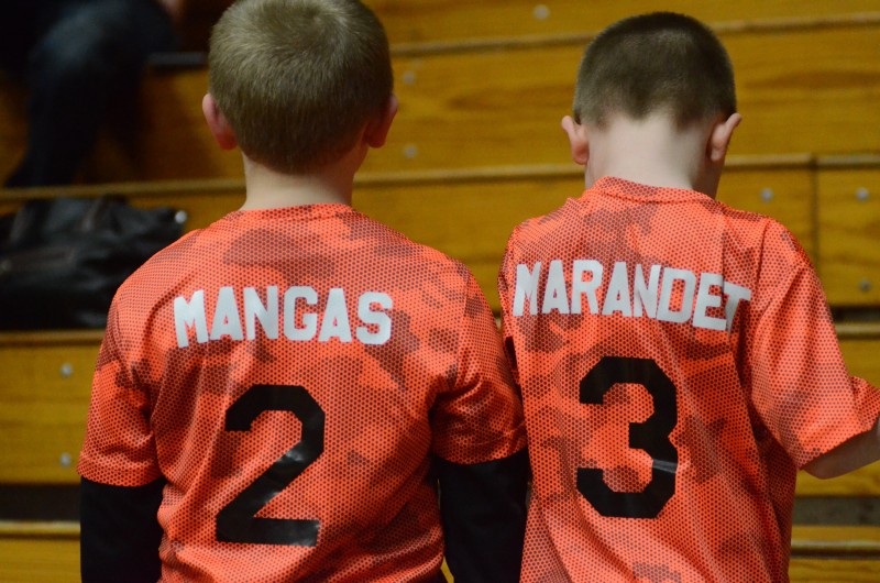These two Warsaw basketball fans, Andrew Shaw (left) and Zachary Reneker, show their support for their favorite Tigers players Kyle Mangas and Paul Marandet at the sectional final Saturday night in Elkhart. 