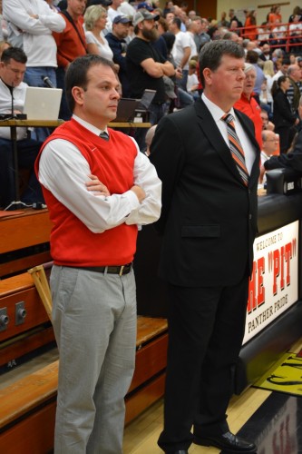 NorthWood coach Aaron Wolfe (at left) is shown with Warsaw coach Doug Ogle. Wolfe, a former assistant coach at Warsaw, has done an outstanding job with the regional-bound Panthers.