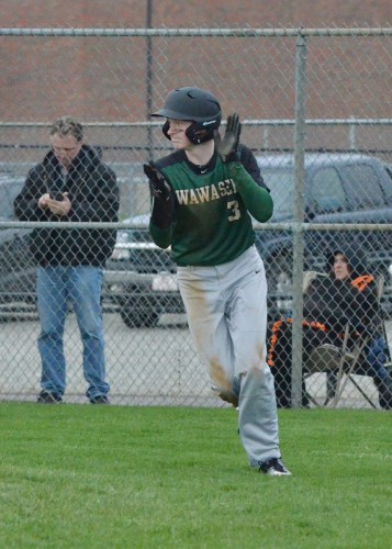 Jairus Boyer shows some enthusiasm after scoring a run in Wednesday's game against Wabash. (Photos by Nick Goralczyk)