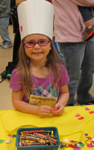 Four-year-old Jessica Targgart models the chef’s hat she made during Preschool Story Time at the North Webster Community Public Library.