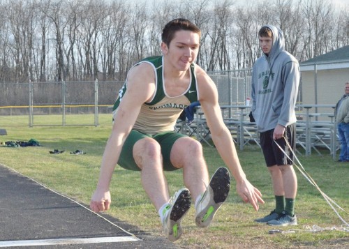 Paul Mendoza launches himself into first place in the long jump pit during Tuesday's meet against East Noble. (Photos by Nick Goralczyk)