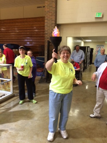 Sandy Bibler carried in the Special Olympics torch to start the tournament at Logansport this past weekend. (Photos provided)