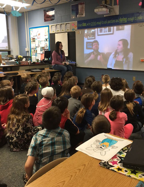 Triton Elementary School second-graders Face Time with their student-teacher's friend and the friend's father. (Photo provided)