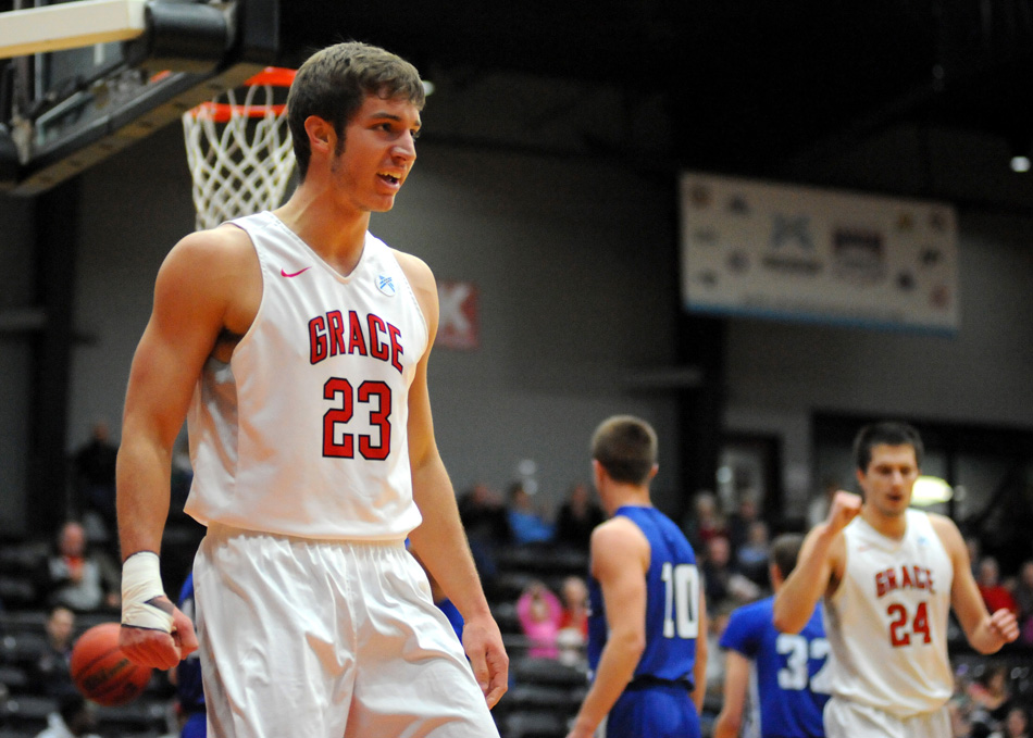 Grace's Caleb Featherston reacts after scoring a basket during the Lancers' 85-66 win against Alice Lloyd in the opening round of the NCCAA Men's Basketball National Championship tournament. (Photos by Mike Deak)