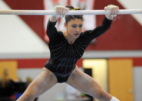 Wawasee's Jada Parzygnot whips through the uneven bars at the Huntington North Gymnastics Regional.