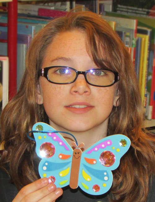 Wray displays her finished Jeweled Butterfly Craft she made during the Wawasee Community School Corporation’s Spring Break.