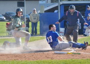 Rieder Hunley slides in safely at home for Wawasee.