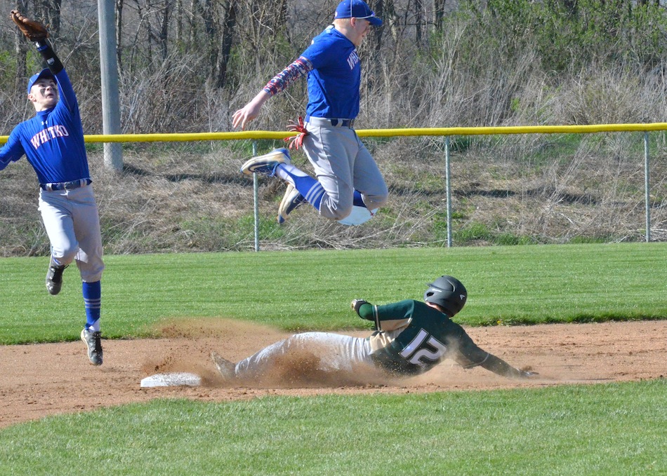 Rylan Kuhn (12) steals second during the first inning of Tuesday's game at Whitko. (Photos by Nick Goralczyk)