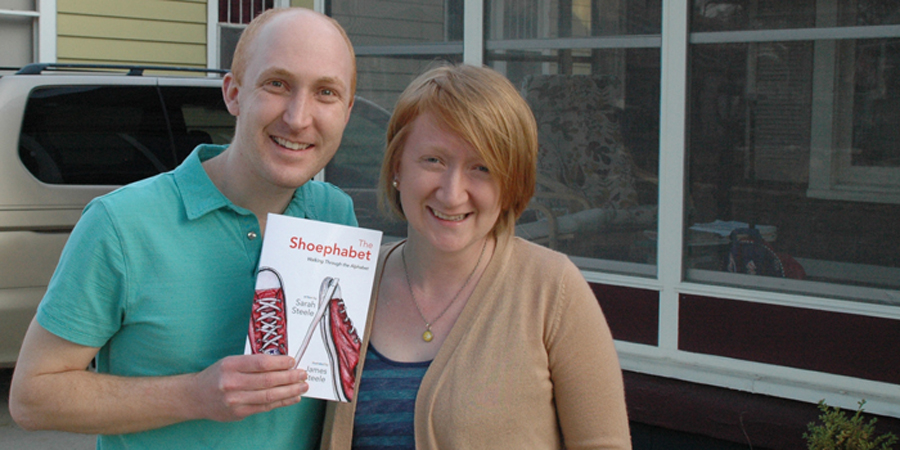 THE SHOEPHABET — James, left and Sarah Steele, of Warsaw hold a copy of their self-published children’s book “The Shoephabet.” The couple have sold more than 400 copies on Etsy, Amazon and at craft fairs. James illustrated and designed the book, and Sarah wrote the text. The illustrations started as an exercise in typography. Their newest book, “The Monsterbet,” was illustrated by Daniel Manduka, who also took the class. (Photo by David Hazledine)