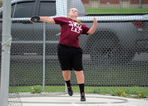 Warsaw's Emily Bailey lets loose on a discus attempt.