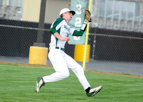 Tim Conley chases down a fly ball.