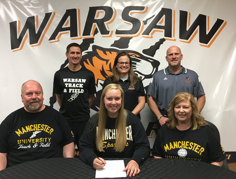 Warsaw Community High School senior Emily Bailey will continue her track and field, along with her volleyball career, to Manchester University to participate in both at the next level. PICTURED (Front, L-R): Herb Bailey, Emily Bailey, Sarah Bailey; (Back): Scott Erba (WCHS Track & Field Coach), Nina Ferry (WCHS Throws Coach), Dave Anson (WCHS Athletic Director).