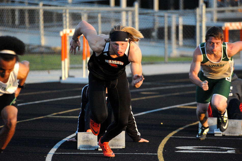 Warsaw's Tommy Hickerson bolts from the blocks in the 200 dash.