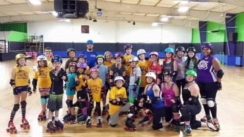 K-County junior derby skaters pose with the Lake City Roller Dolls last October. (Photos courtesy of Andy Kerr Photography)
