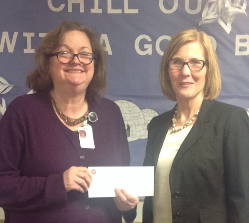 Shown are Cindy Cates, executive director of Kosciusko Literacy Services, and Karen Mayer, manager of Teachers Credit Union, Warsaw. The TCU foundation recently awarded $2,000 to Read to Grow Children's Book Club, part of Kosciusko Literacy Services.