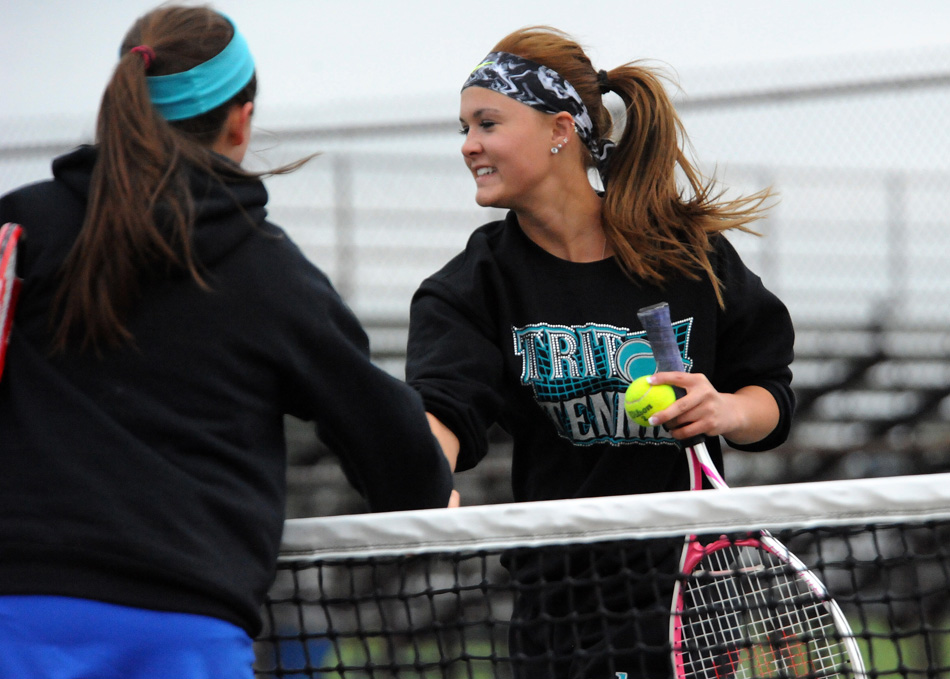 Triton's Megan McFarland shakes hands with her North Judson opponents after McFarland and Tatum Thompson won their No. 2 doubles match.