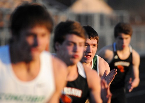 Wawasee's Michael Katzer, center, looks to make a move in the 200 dash.