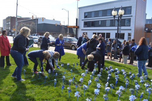 Approximately 40 people came out to plant the first pinwheel garden on the south lawn of the Kosciusko County Court House. The garden was planted in honor of Child Abuse Prevention Month.