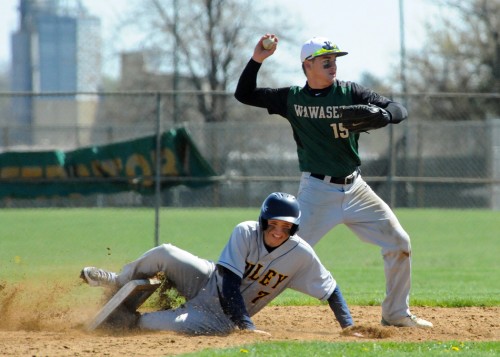Wawasee's Jamie Slabaugh tries to turn a double play as Riley's Trevor Backstorm unearth's the bag.