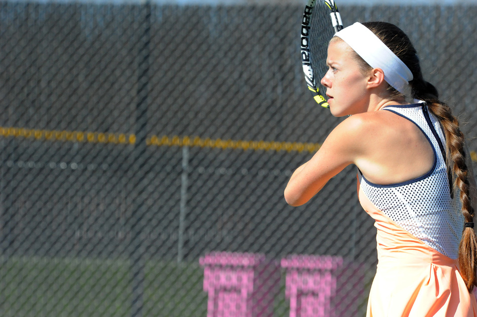 Warsaw's Colette Smith returns a volley Saturday against Valparaiso's Alexis Orlich at the Warsaw Tennis Invitational. (Photos by Mike Deak)