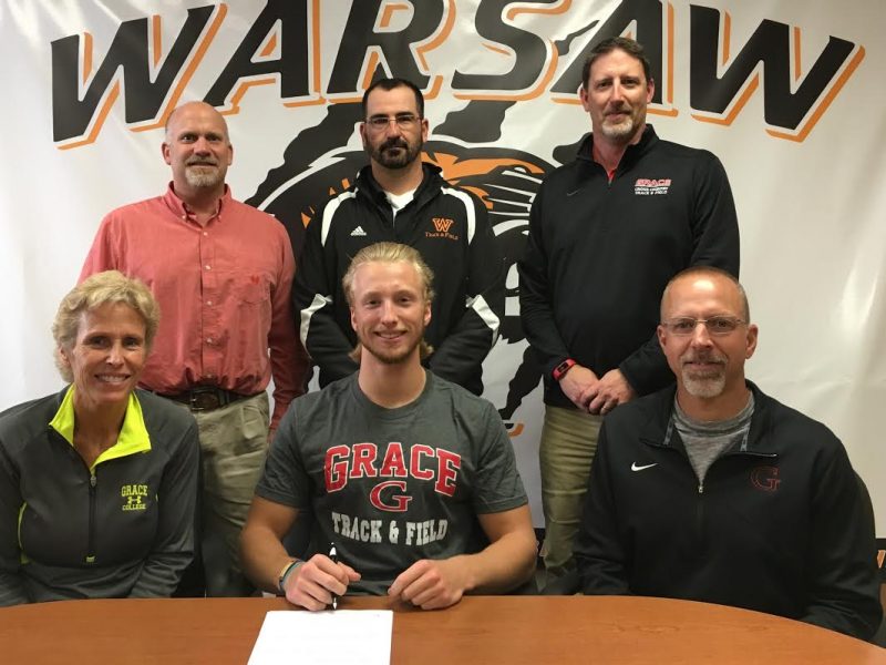 WCHS senior Tommy Hickerson signs to continue his track career at Grace College. Nickerson is shown with his parents Jo and Bryan. In back are WCHS Athletic Director Dave Anson, WCHS boys track coach Matt Thacker and Grace College track coach Jeff Raymond (Photo provided)