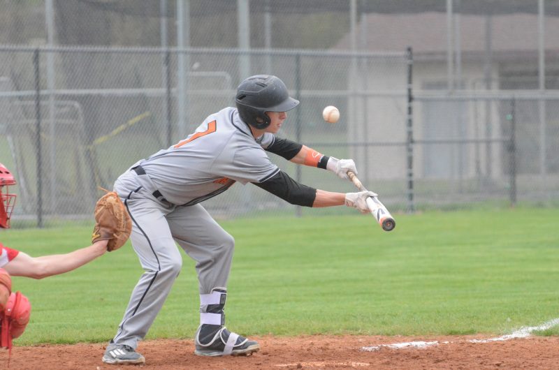 Henry Howard attempts to put down a bunt for Warsaw Monday night. The Tigers lost 1-0 at Elkhart Memorial in conference play.