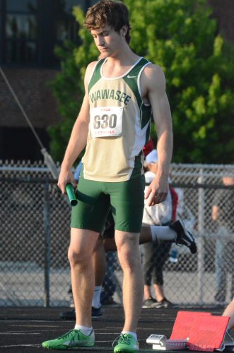 Cole VanLue prepares for the start of the 4 X 100 relay. The Wawasee junior had a strong showing in the Goshen Sectional Thursday night.
