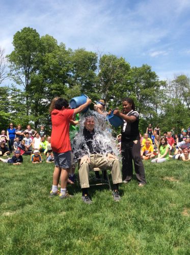 Madison Elementary student council members dumped a bucket of water on Principal Kline after successfully raising money for Riley. 