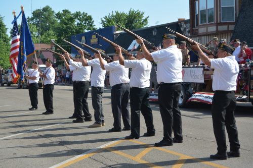 Members of the Milford American Legion Post 226 Honor Guard perform a 21-gun salute during the 2016 Milford Memorial Day parade.