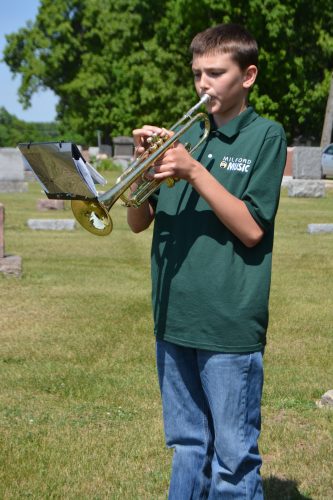 Milford Middle School seventh-grade student Griffin Noel performed Taps during the memorial ceremony held at Milford Cemetery on Memorial Day.